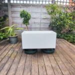 two slugstands protect a large planter from slugs